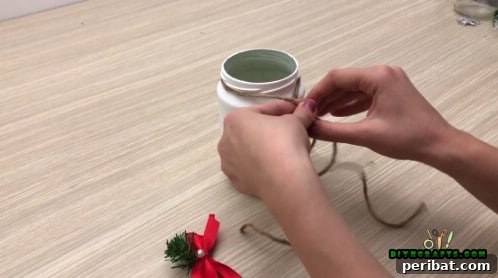 5 Frugal & Festive Christmas Jar Decorations 7 Step 4: Tie a piece of twine or ribbon around the top of the decorated jar.