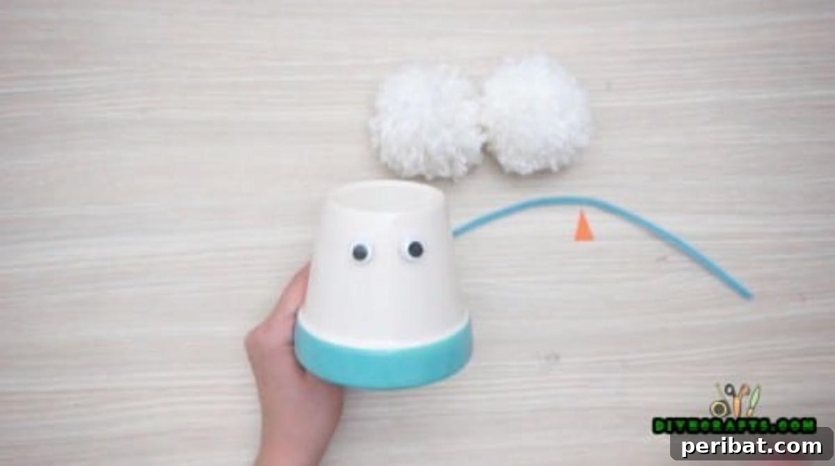 Minute-Made Snowmen: 5 Speedy & Creative Crafts 12 Close-up of the earmuff snowman with googly eyes attached
