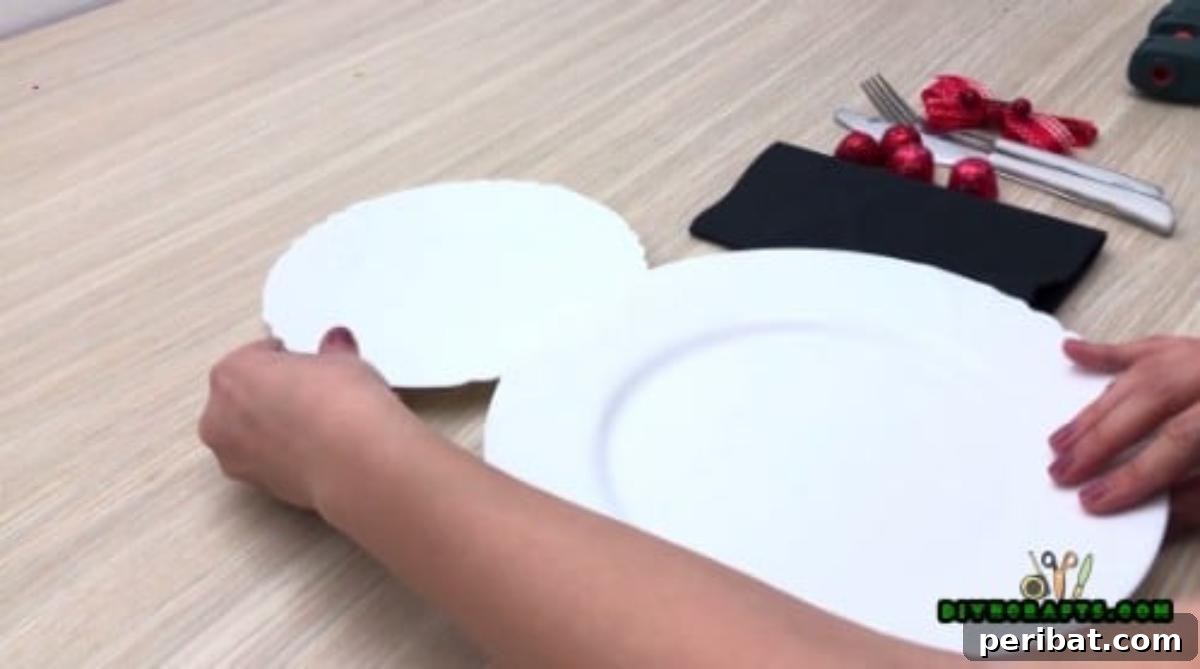 Minute-Made Snowmen: 5 Speedy & Creative Crafts 24 A larger dinner plate and a smaller plate arranged to form the body and head of a snowman place setting