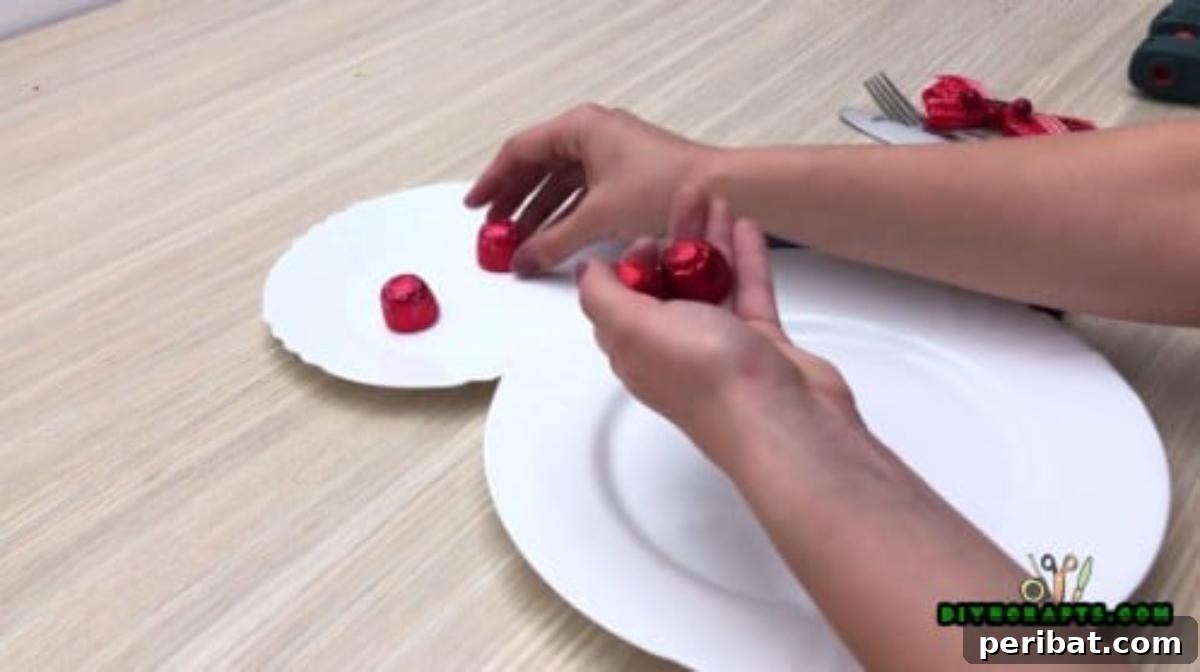 Minute-Made Snowmen: 5 Speedy & Creative Crafts 25 Two candies placed on the smaller plate to create the snowman's eyes for a festive place setting