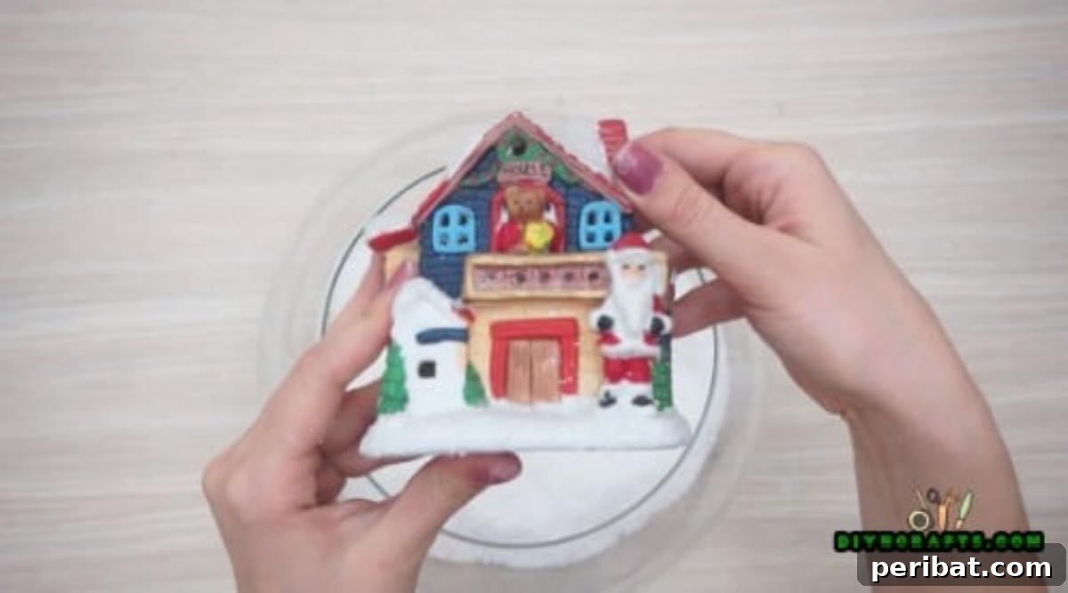 Minute-Made Snowmen: 5 Speedy & Creative Crafts 31 A festive winter scene created with small figurines and craft snow inside a large fishbowl