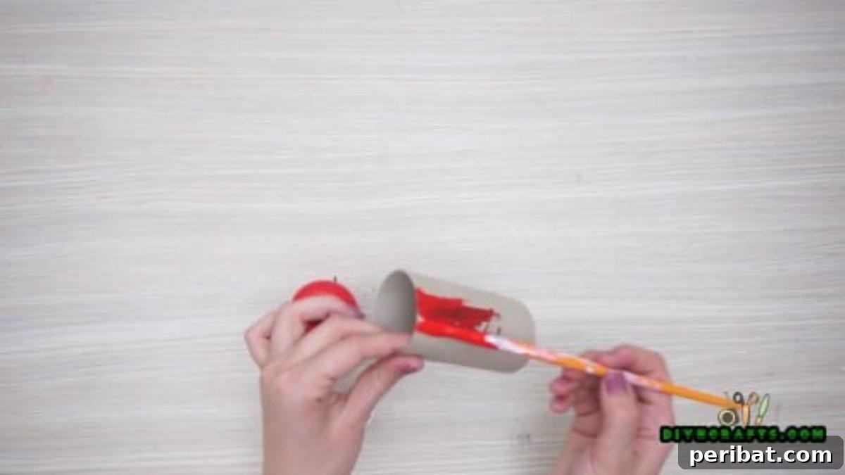 Upcycle Paper Rolls: 5 Easy Holiday Decoration Ideas 2 Christmas Poinsettia - Step 1: Paint paper roll red for petals