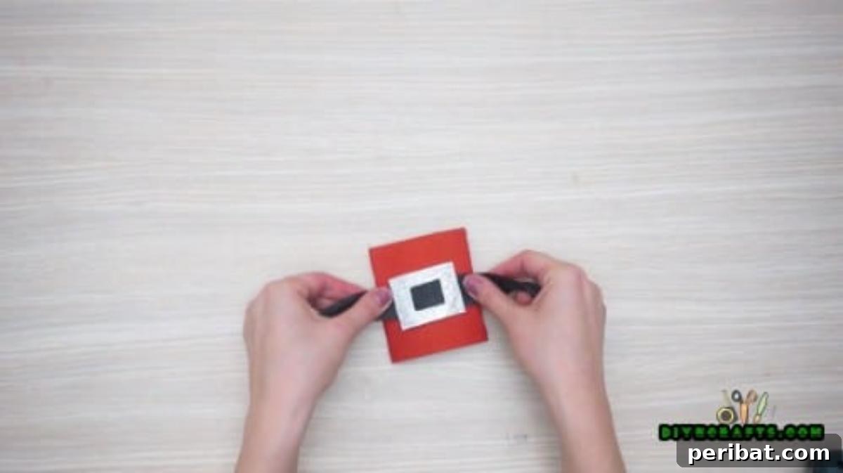Upcycle Paper Rolls: 5 Easy Holiday Decoration Ideas 11 Napkin Ring - Step 4: Adding a cardboard buckle to the ribbon