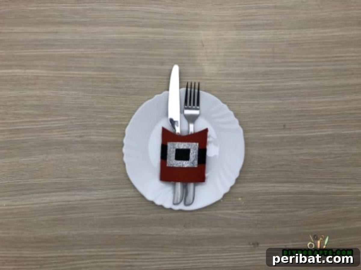 Upcycle Paper Rolls: 5 Easy Holiday Decoration Ideas 13 Napkin Ring - Final: Napkin ring with napkin and silverware