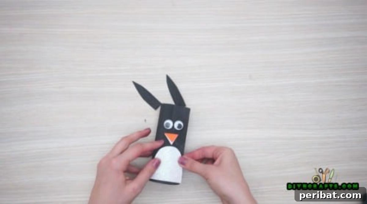 Upcycle Paper Rolls: 5 Easy Holiday Decoration Ideas 23 Cute Penguin - Step 4: Adding white paper for the belly
