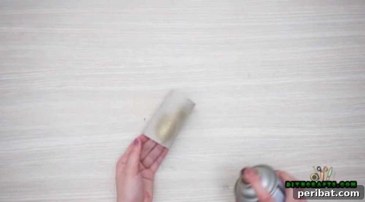 Upcycle Paper Rolls: 5 Easy Holiday Decoration Ideas 27 Flower Wreath - Step 2: Cutting metallic painted roll into strips