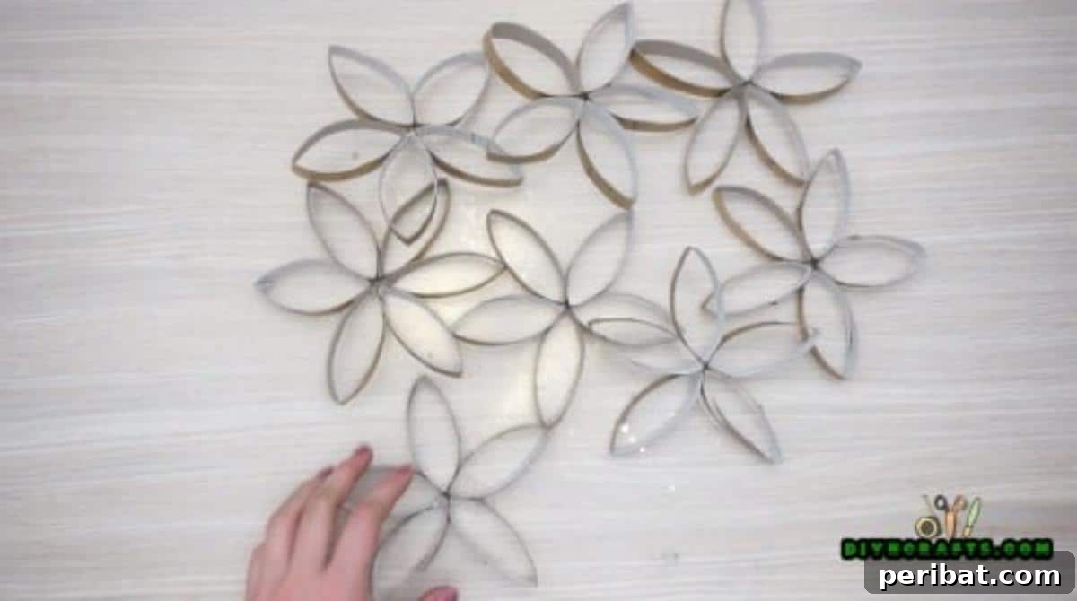 Upcycle Paper Rolls: 5 Easy Holiday Decoration Ideas 30 Flower Wreath - Step 5: Gluing metallic flowers together to form wreath