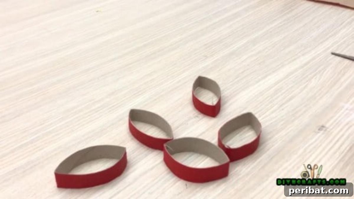 Upcycle Paper Rolls: 5 Easy Holiday Decoration Ideas 5 Christmas Poinsettia - Step 2: Cutting flattened roll into strips