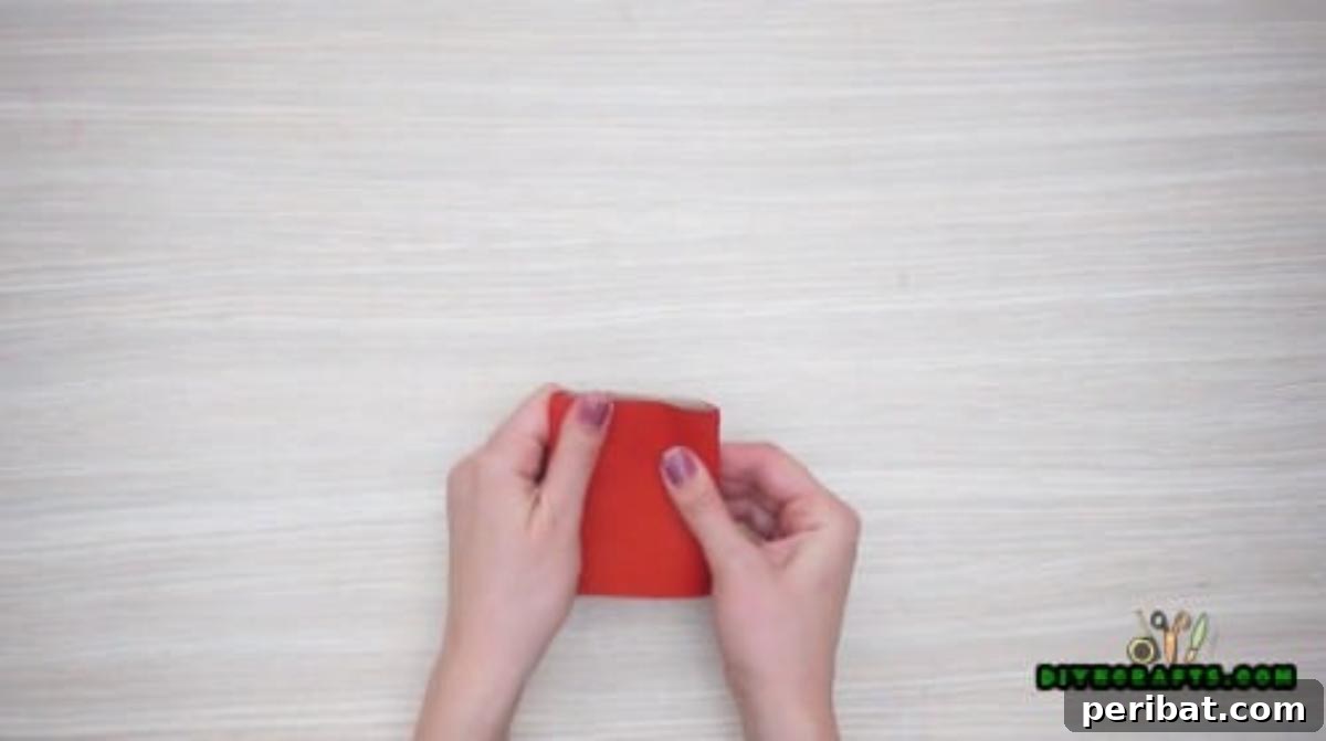 Upcycle Paper Rolls: 5 Easy Holiday Decoration Ideas 9 Napkin Ring - Step 2: Flattening the painted paper roll