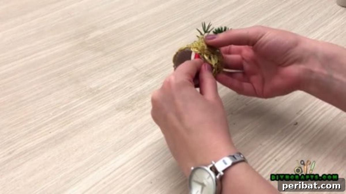 Instant Holiday Glam: 5 Napkin Rings in Less Than 2 Mins 11 Attaching Pine Sprig and Berries to Napkin Ring