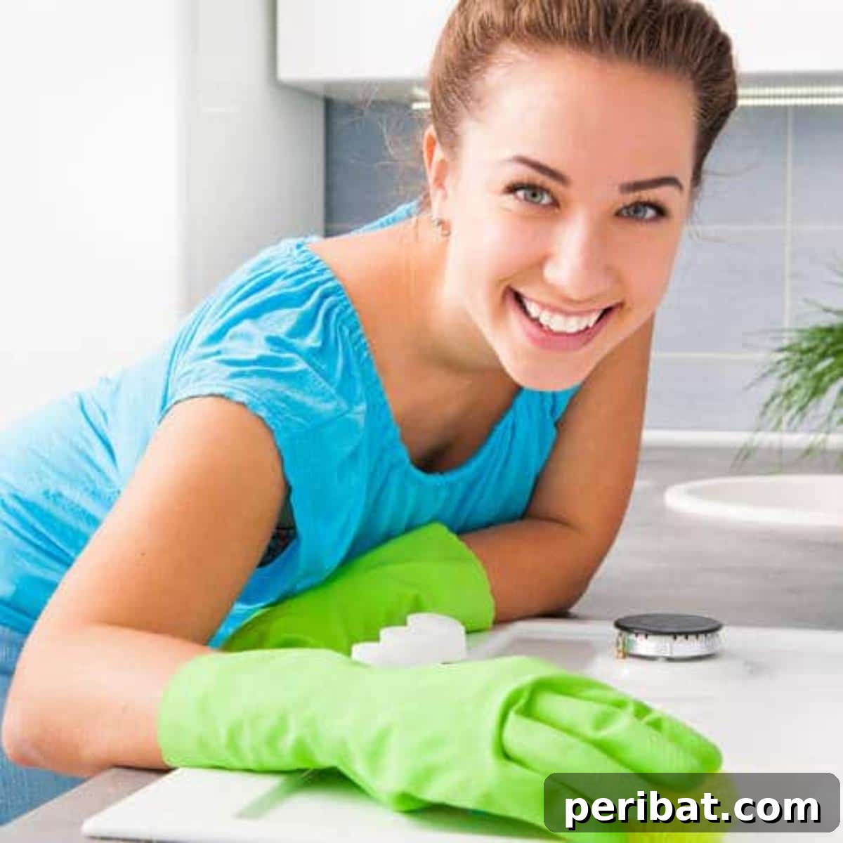 10 Genius Borax Hacks for a Smarter Home 5 A smiling woman cleaning a desk.
