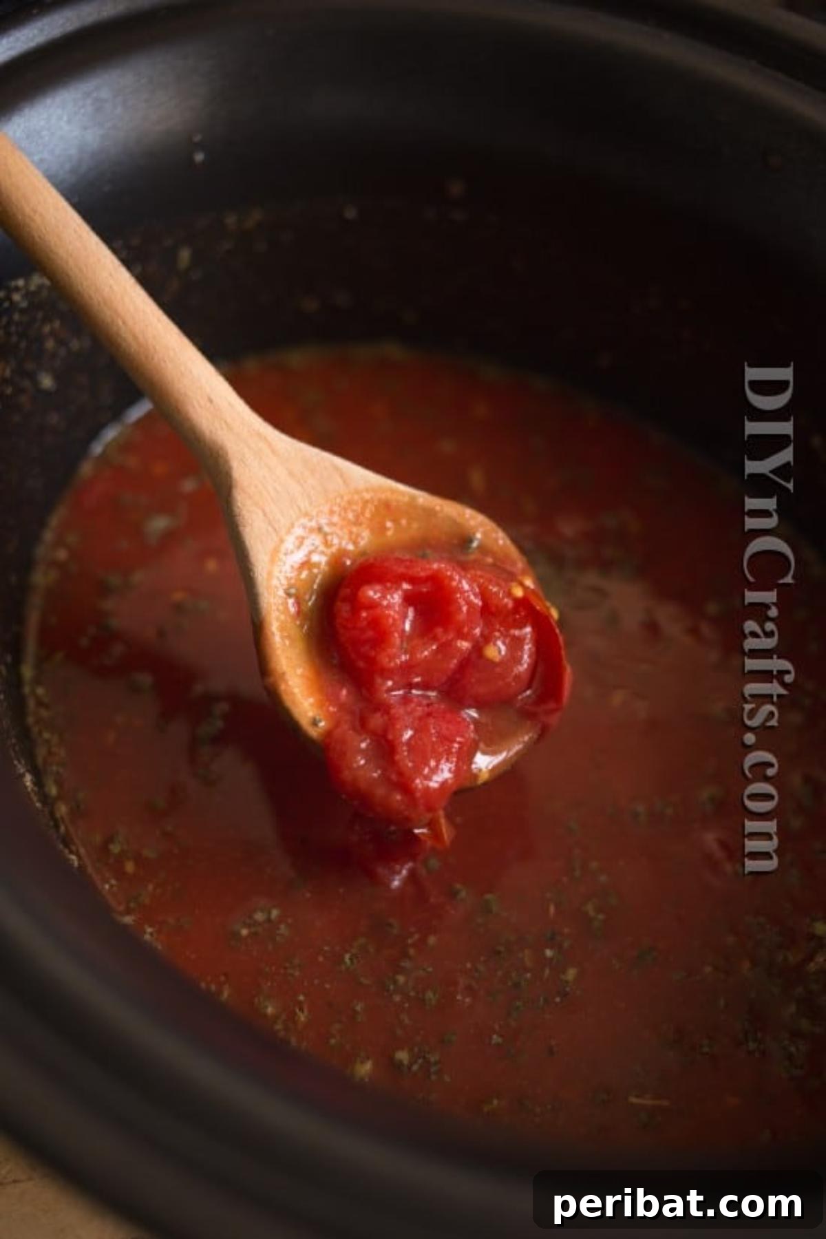 Canned tomatoes, tomato paste and basil create a rich slow cooker sauce