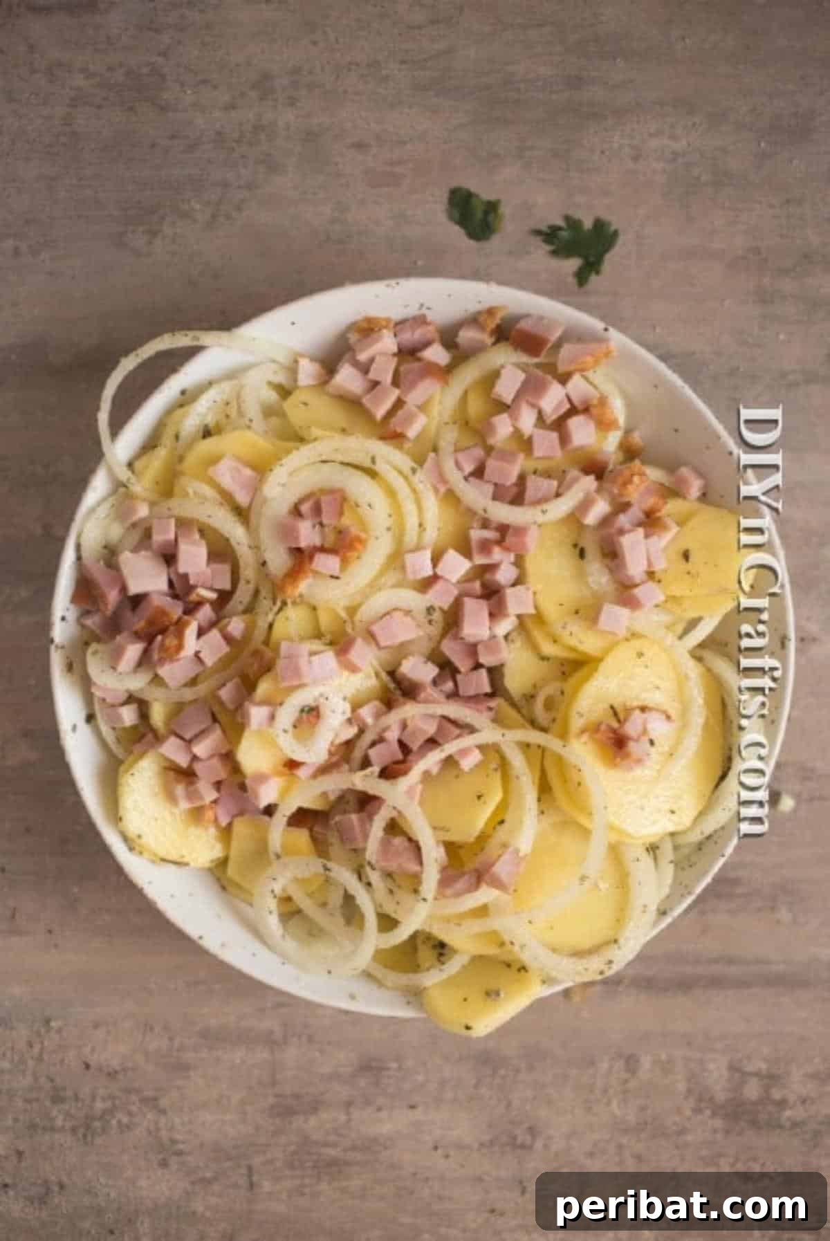 Onions and ham added to potatoes for a complete dish