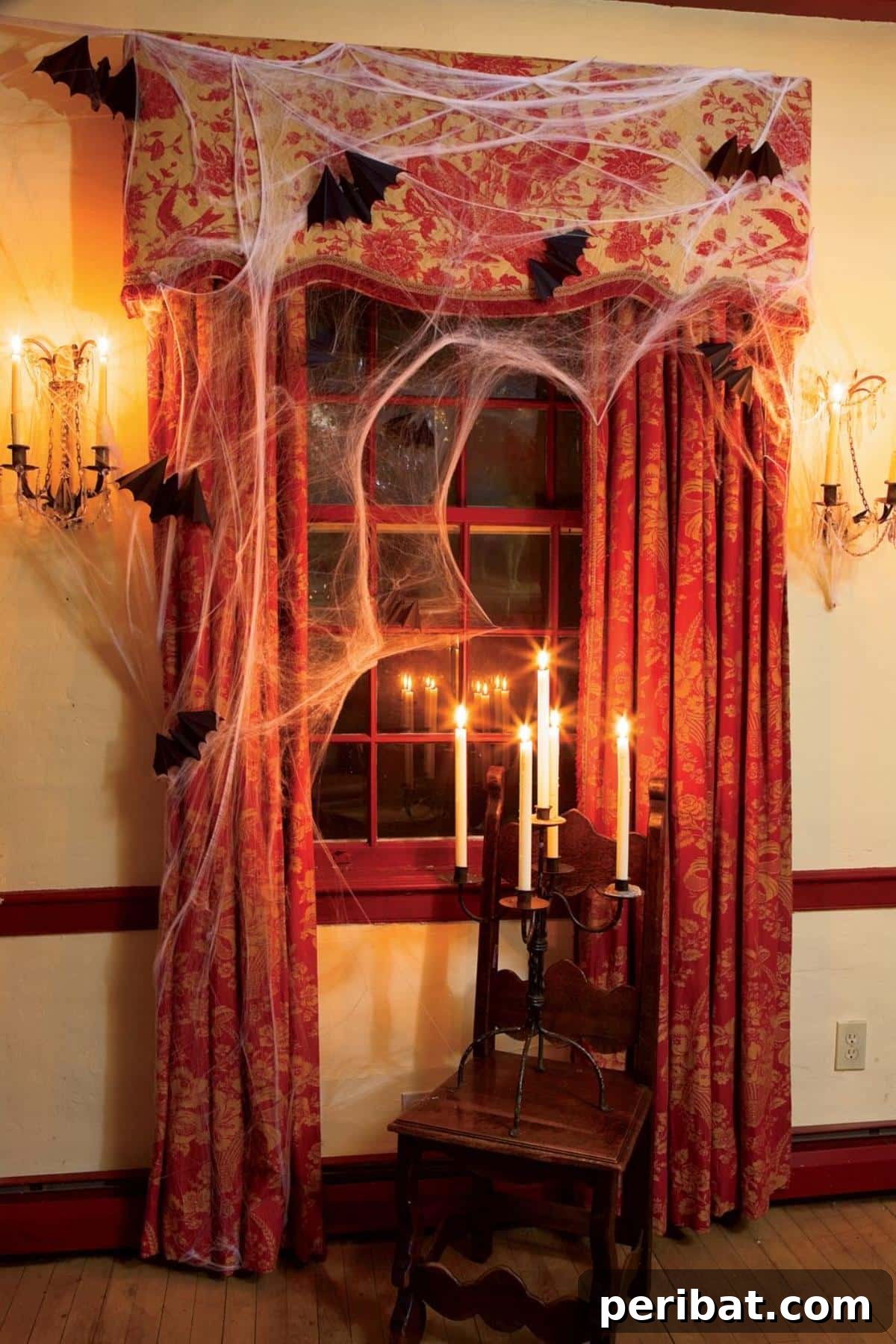 40 Spooktacularly Simple DIY Halloween Decorations 27 DIY Eerie Window Halloween decoration with spider webs and bats