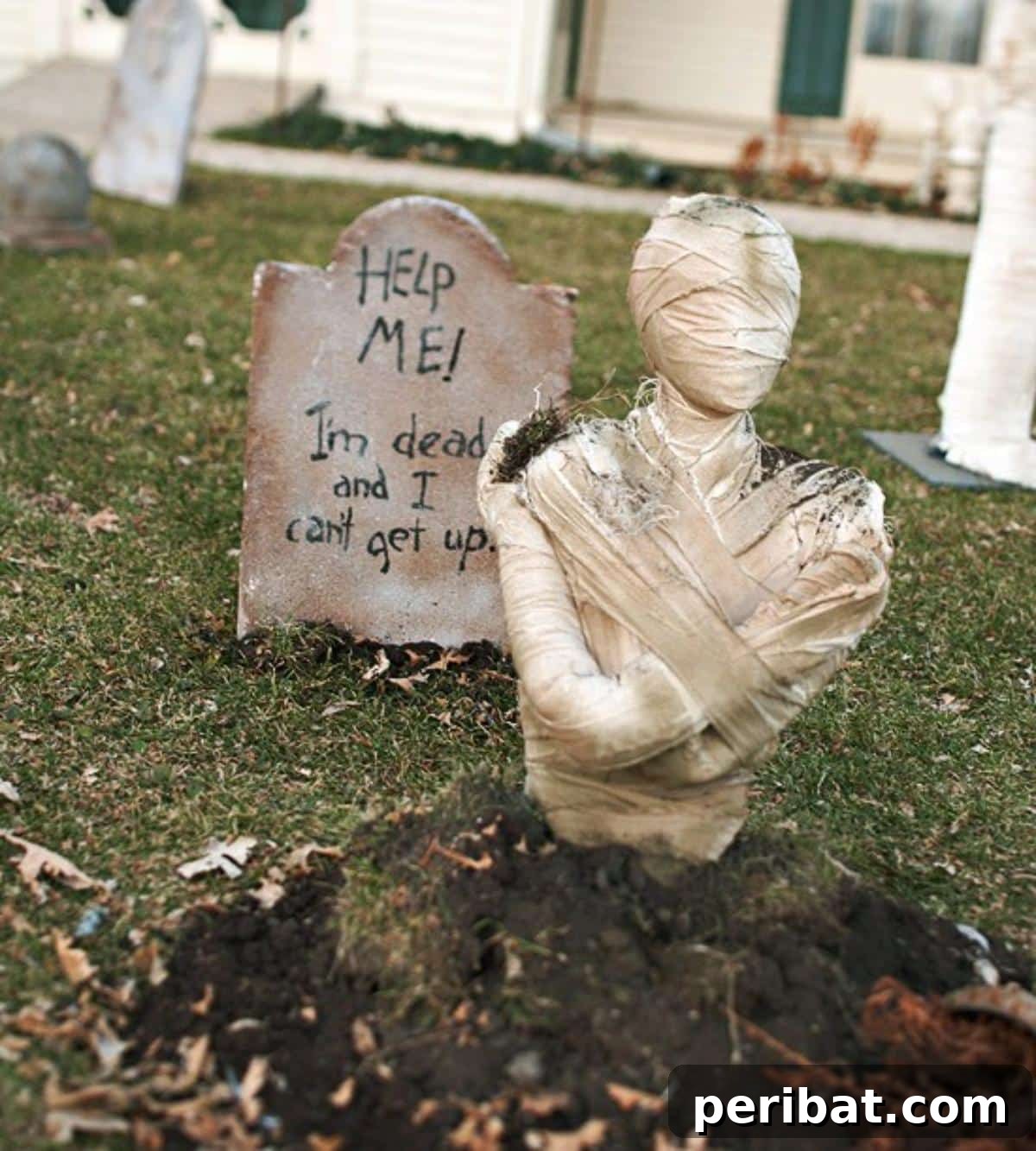 40 Spooktacularly Simple DIY Halloween Decorations 33 DIY Eerie Mummy Graveyard Halloween decoration with tombstones and mummy figures