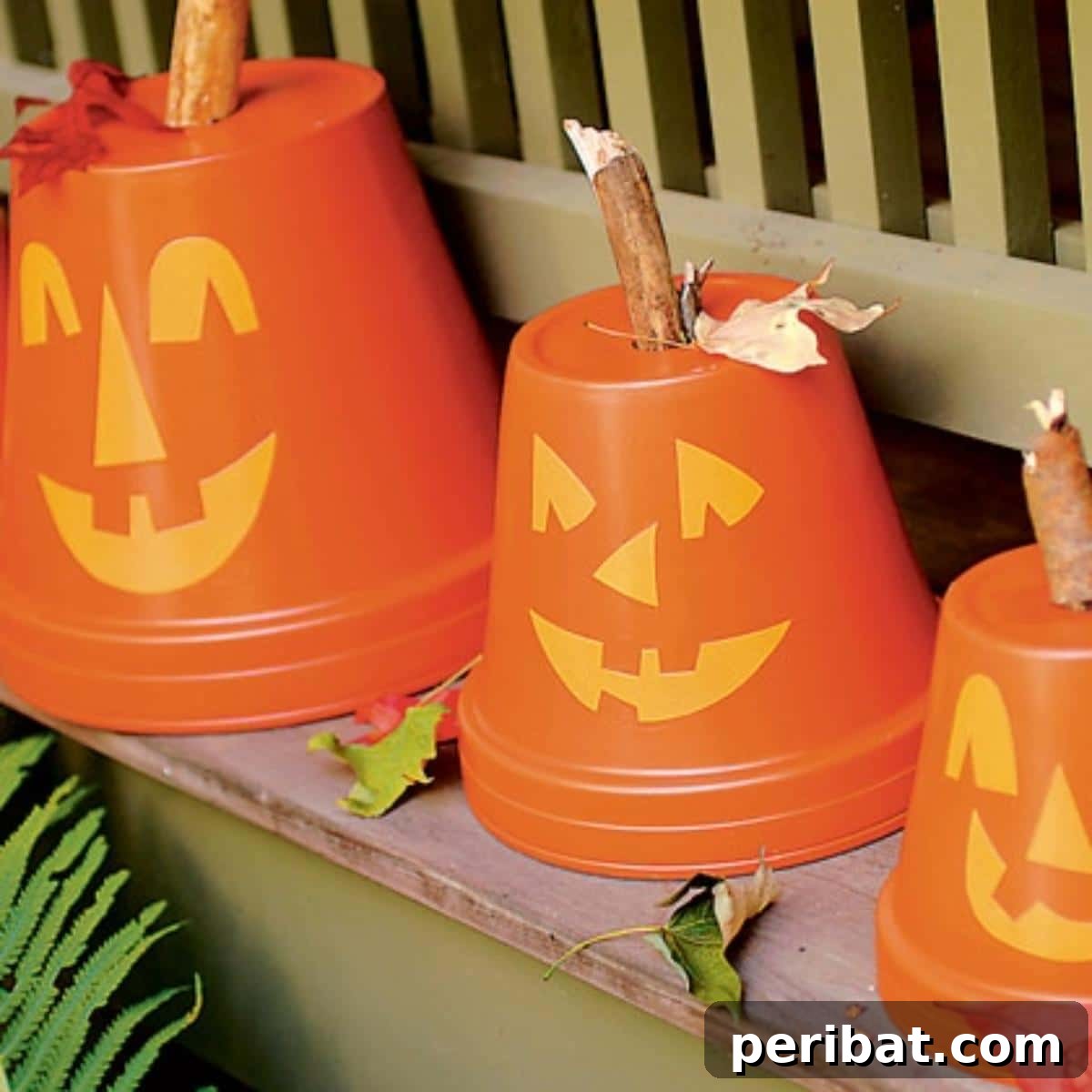 40 Spooktacularly Simple DIY Halloween Decorations 46 DIY Flowerpot Pumpkins made from terracotta pots