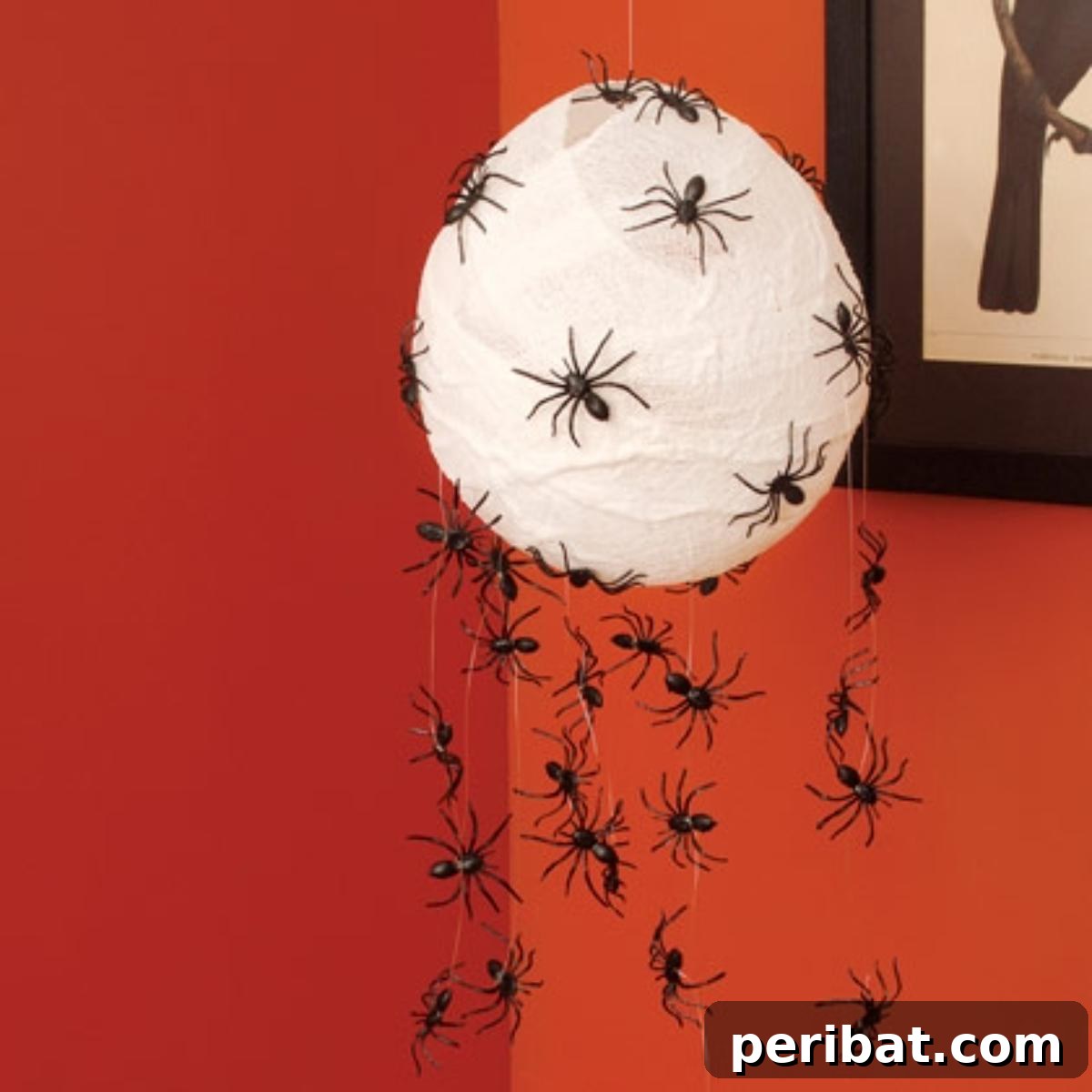40 Spooktacularly Simple DIY Halloween Decorations 48 DIY Scary Spider Hatchlings Halloween decoration with a balloon and toy spiders