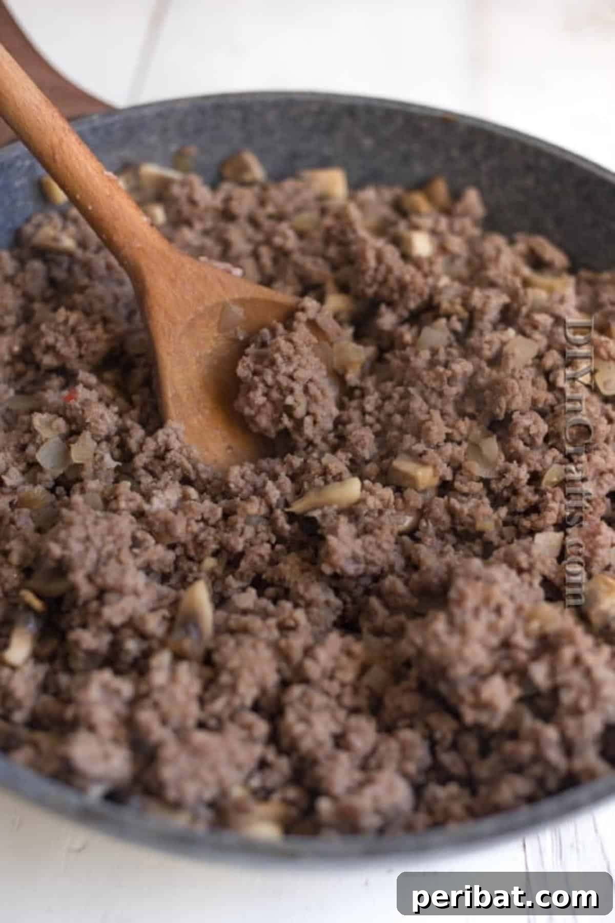 Brown ground beef with onions until no longer pink