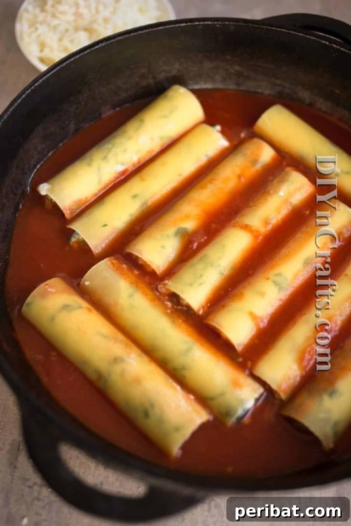 Lazy Cannelloni: Your Easy Answer to Italian Cravings 7 Layer filled cannelloni over canned tomatoes for a delicious and quick Italian meal