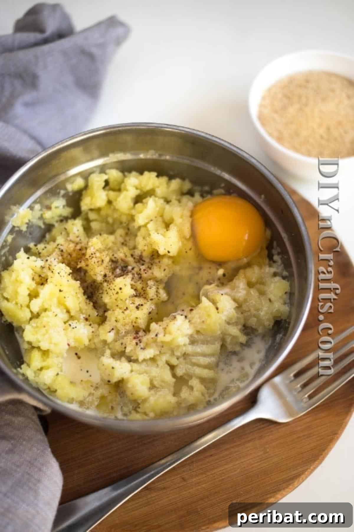 Reimagined Potato Spinach Patties A Delicious Classic 4 Close up of mashed potato mixture with cream and egg, ready to be combined with vegetables