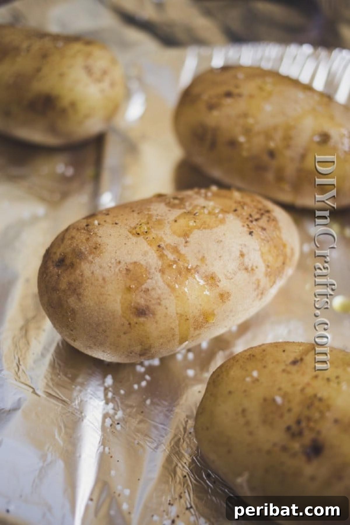 Prick potatoes with a fork and drizzle with olive oil before cooking