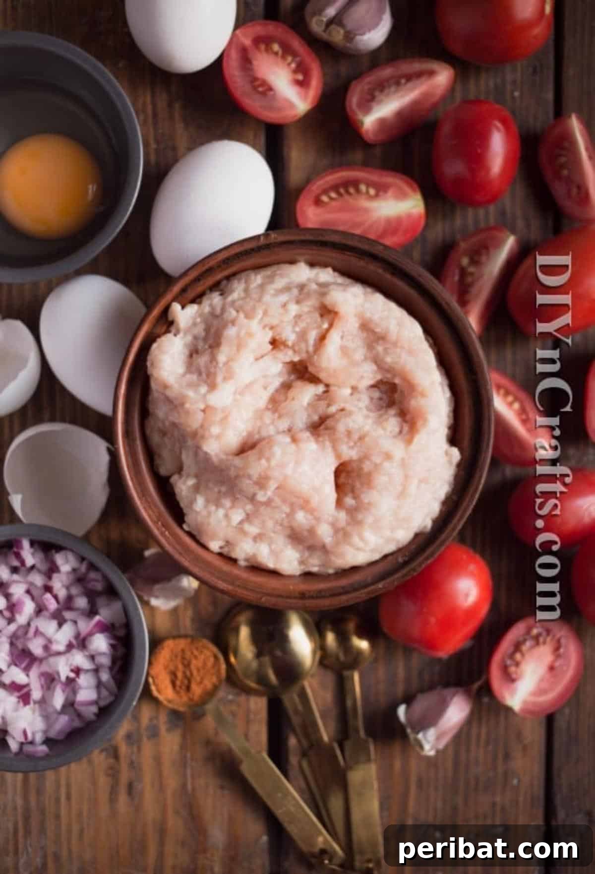 One Pan Turkey Egg Leftover Brunch 3 Ingredients for One Pot Egg And Turkey Bake laid out on a wooden board: minced turkey, eggs, tomatoes, onion, garlic, and spices.