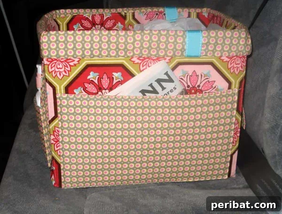 Effortless DIY Car Organization Hacks 21 A creatively upcycled diaper box transformed into a stylish and practical car tote, perfect for organizing toys, books, and other child essentials, making use of available space.