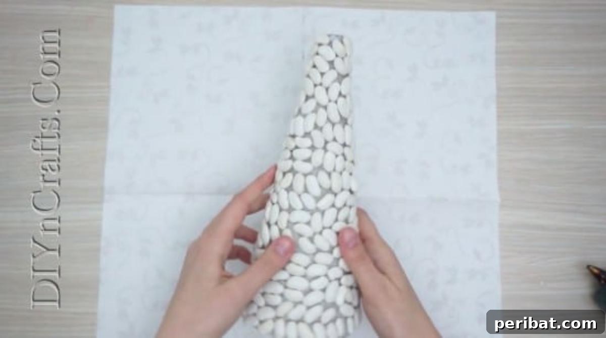 The paper cone mostly covered with beans, showcasing the organic texture.