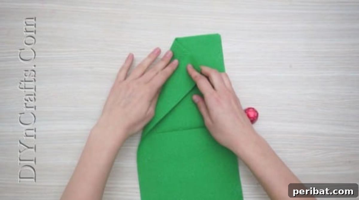 Festive Folds: 5 Simple Christmas Napkin Designs 3 Christmas Tree - How to Fold These 5 Easy and Decorative Christmas Napkins