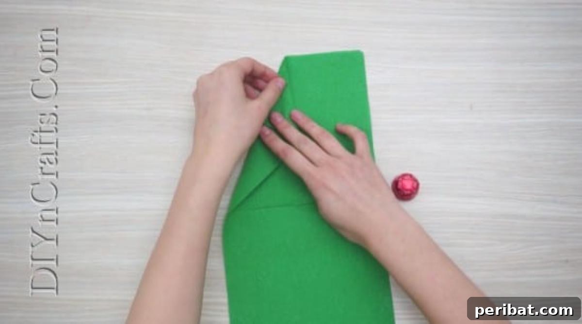 Festive Folds: 5 Simple Christmas Napkin Designs 4 Christmas Tree - How to Fold These 5 Easy and Decorative Christmas Napkins