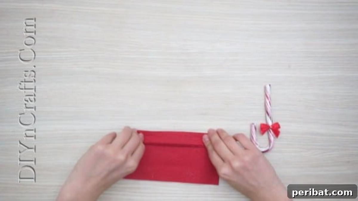 Festive Folds: 5 Simple Christmas Napkin Designs 32 Candy Cane Umbrella - How to Fold These 5 Easy and Decorative Christmas Napkins