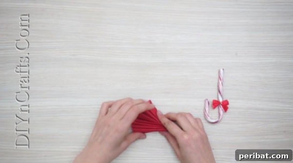 Festive Folds: 5 Simple Christmas Napkin Designs 33 Candy Cane Umbrella - How to Fold These 5 Easy and Decorative Christmas Napkins