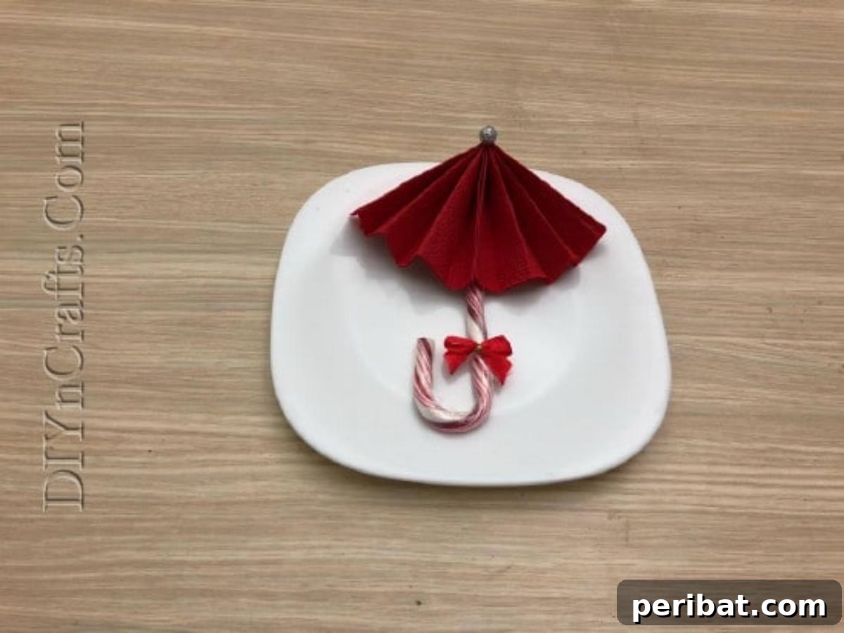 Festive Folds: 5 Simple Christmas Napkin Designs 37 Candy Cane Umbrella - How to Fold These 5 Easy and Decorative Christmas Napkins