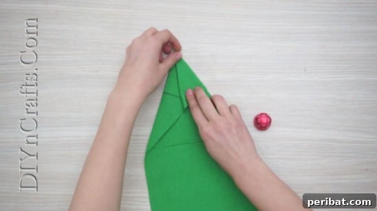 Festive Folds: 5 Simple Christmas Napkin Designs 5 Christmas Tree - How to Fold These 5 Easy and Decorative Christmas Napkins