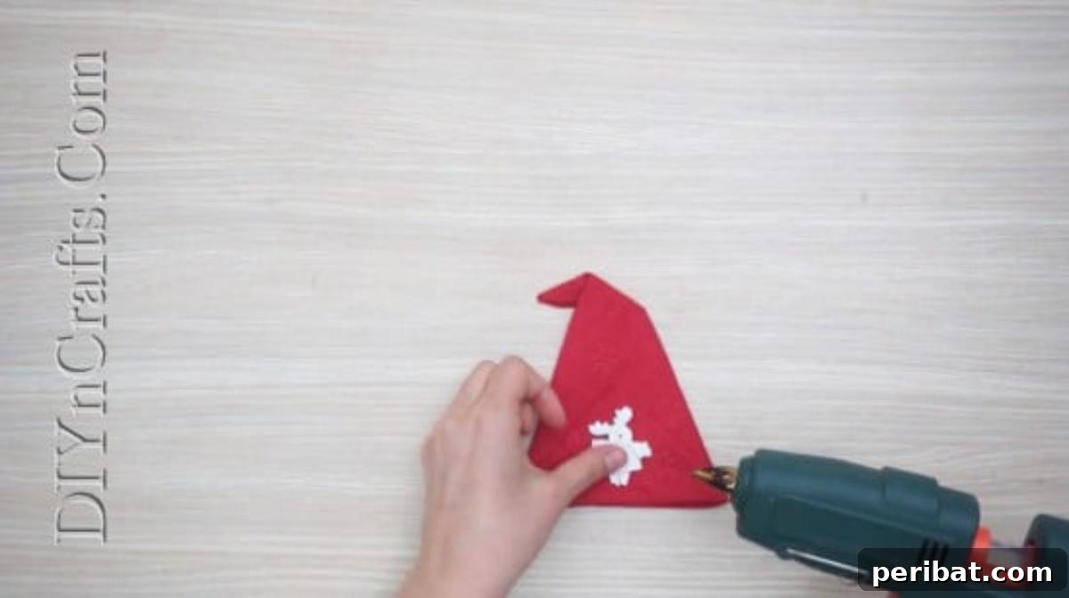 Festive Folds: 5 Simple Christmas Napkin Designs 42 Santa Hat - How to Fold These 5 Easy and Decorative Christmas Napkins