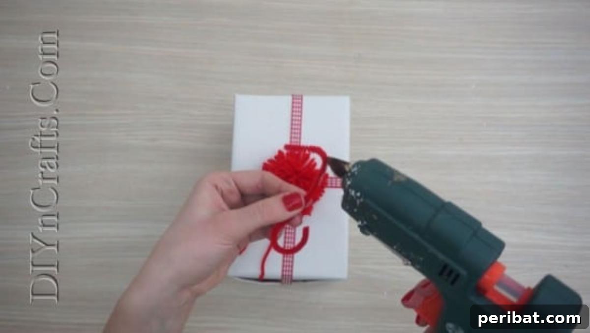 Gift Box - Decorating a gift box with a pom-pom, ribbon, and other embellishments for Christmas