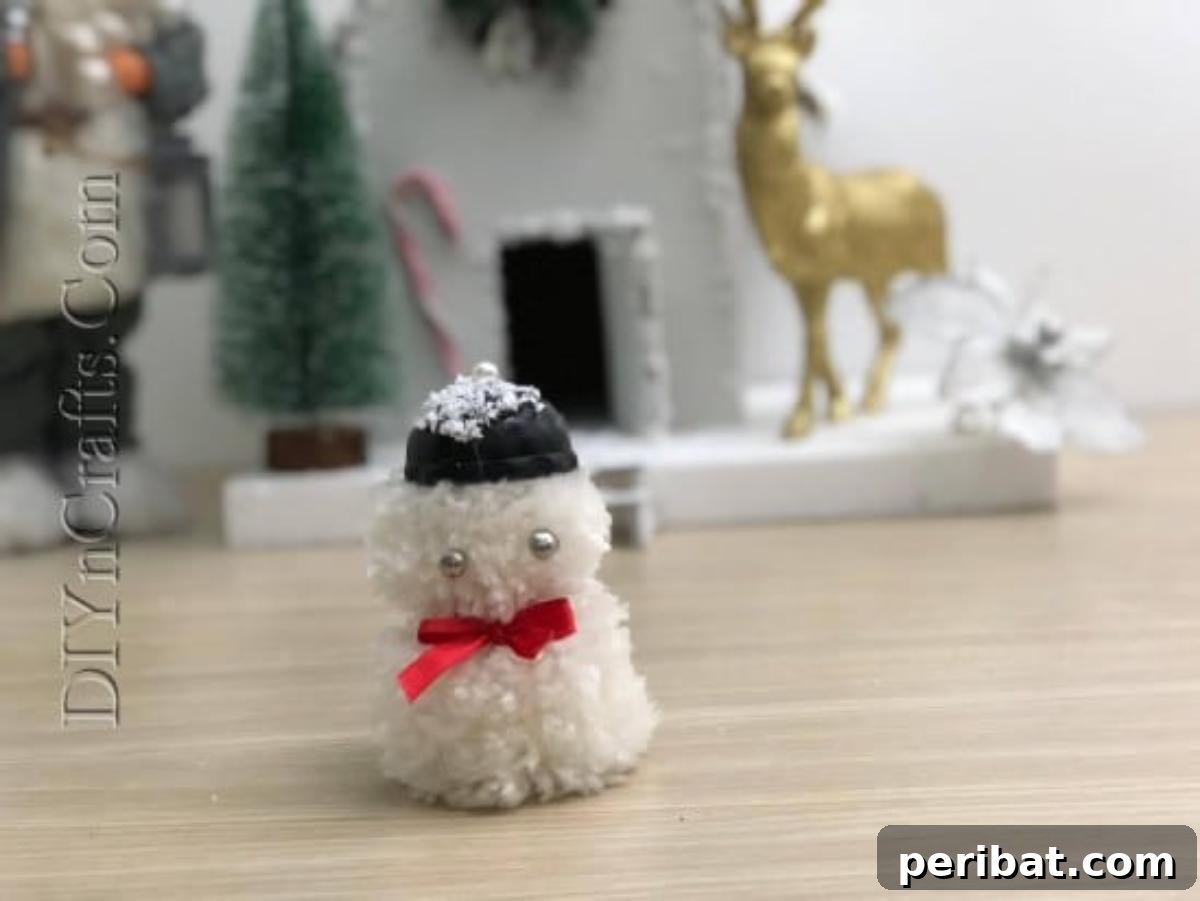 Snowman - A delightfully complete pom-pom snowman, perfect for Christmas decorations