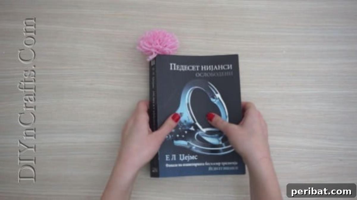 Bookmark - Another perspective of the colorful pom-pom bookmark in use