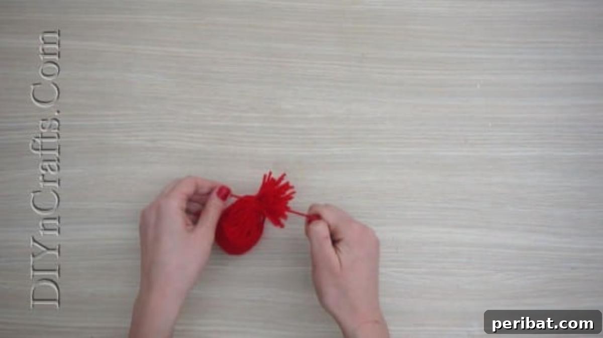 Hats - The tied yarn forms the conical shape of the miniature Christmas hat