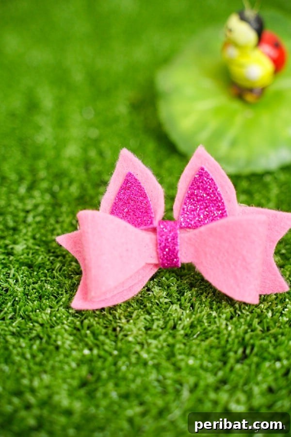 35+ Ingenious No-Sew Craft Ideas 5 Adorable pink no-sew hair bow resting on green grass