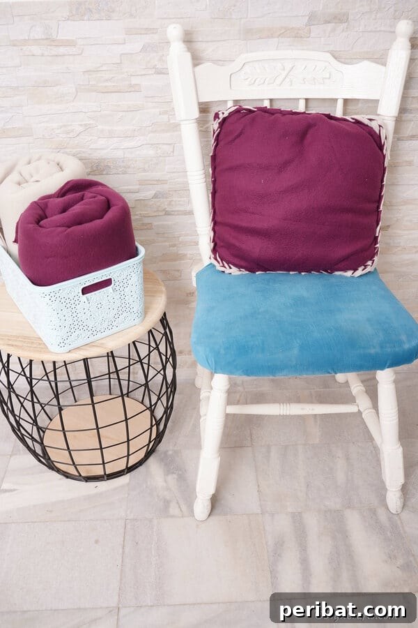 35+ Ingenious No-Sew Craft Ideas 17 Cozy purple fleece no-sew pillow resting on a chair