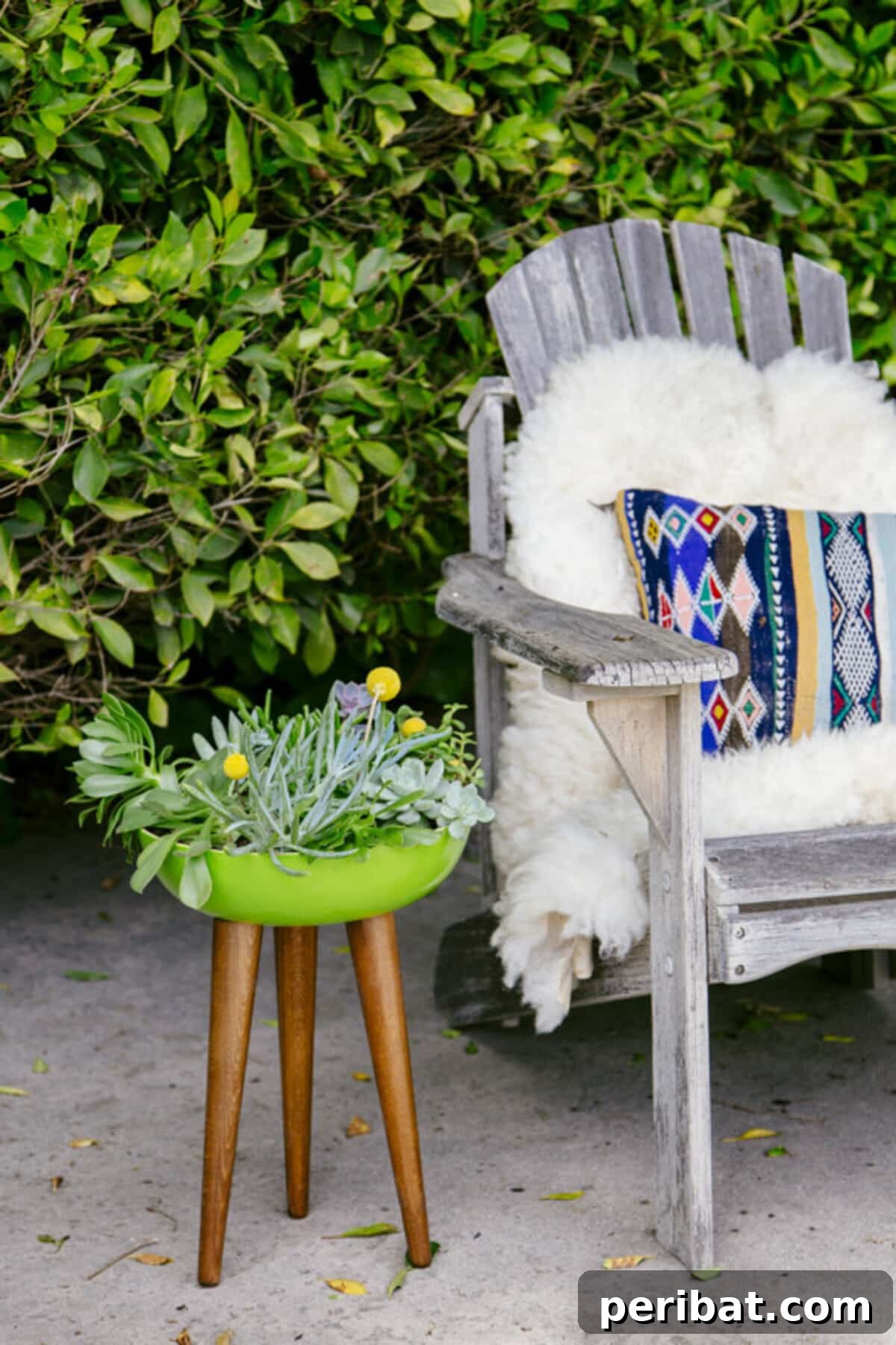 Unlock Your Garden's Potential: 12 Genius IKEA Hacks 13 An easy DIY tripod planter, ingeniously crafted from an IKEA Rundlig bowl and three sturdy legs, showcasing a vibrant succulent arrangement, designed to add modern style and elevated greenery to outdoor sitting areas.