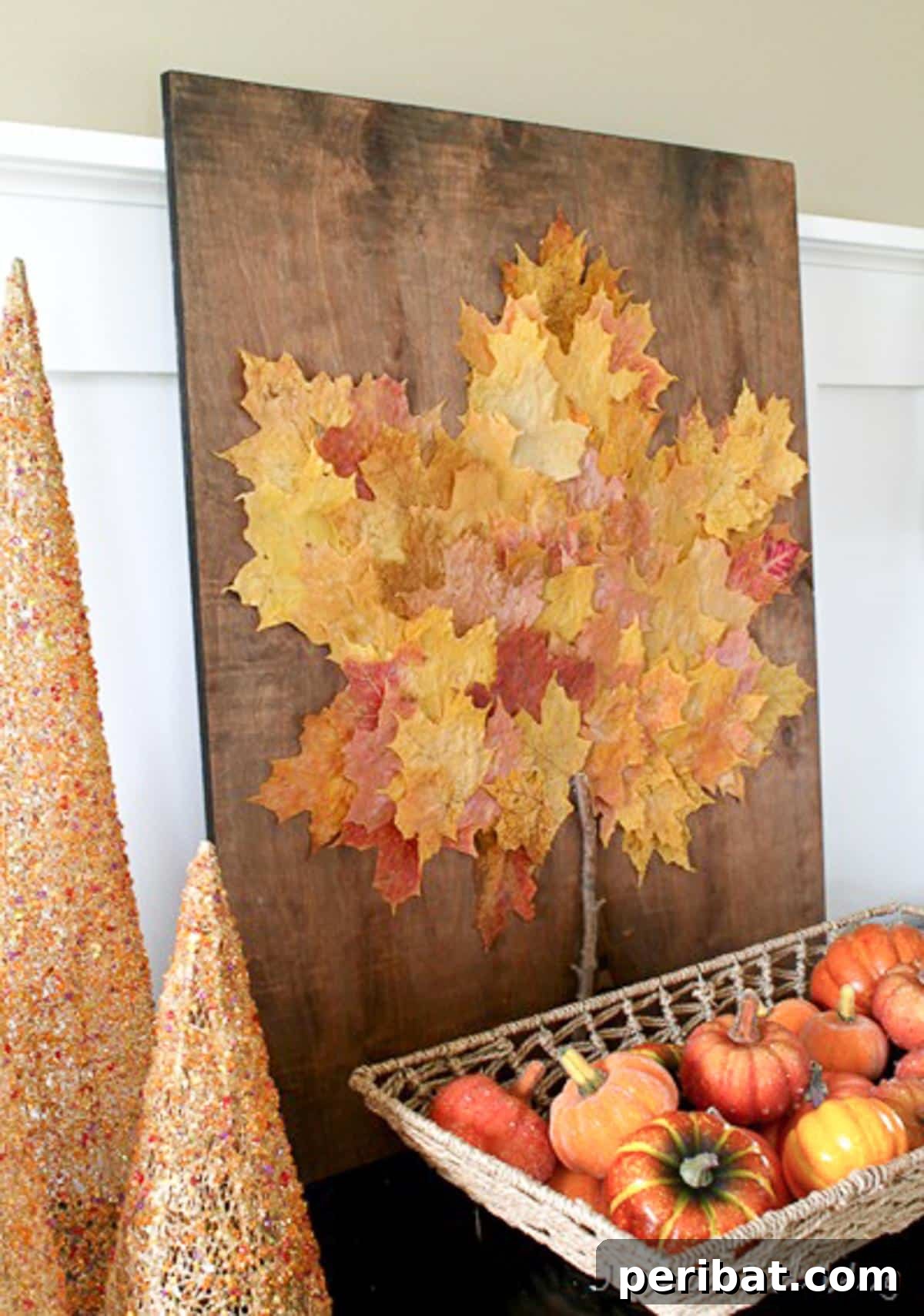 Autumn's Bounty: Creative Leaf Crafts for Young Explorers 13 Thanksgiving Wall Art featuring a collage of real fall leaves arranged on a board.