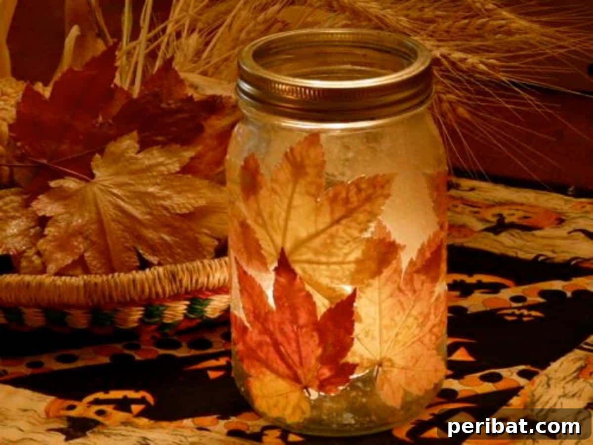 Autumn's Bounty: Creative Leaf Crafts for Young Explorers 17 Leaf Lantern, a mason jar decorated with fall leaves and illuminated from within.