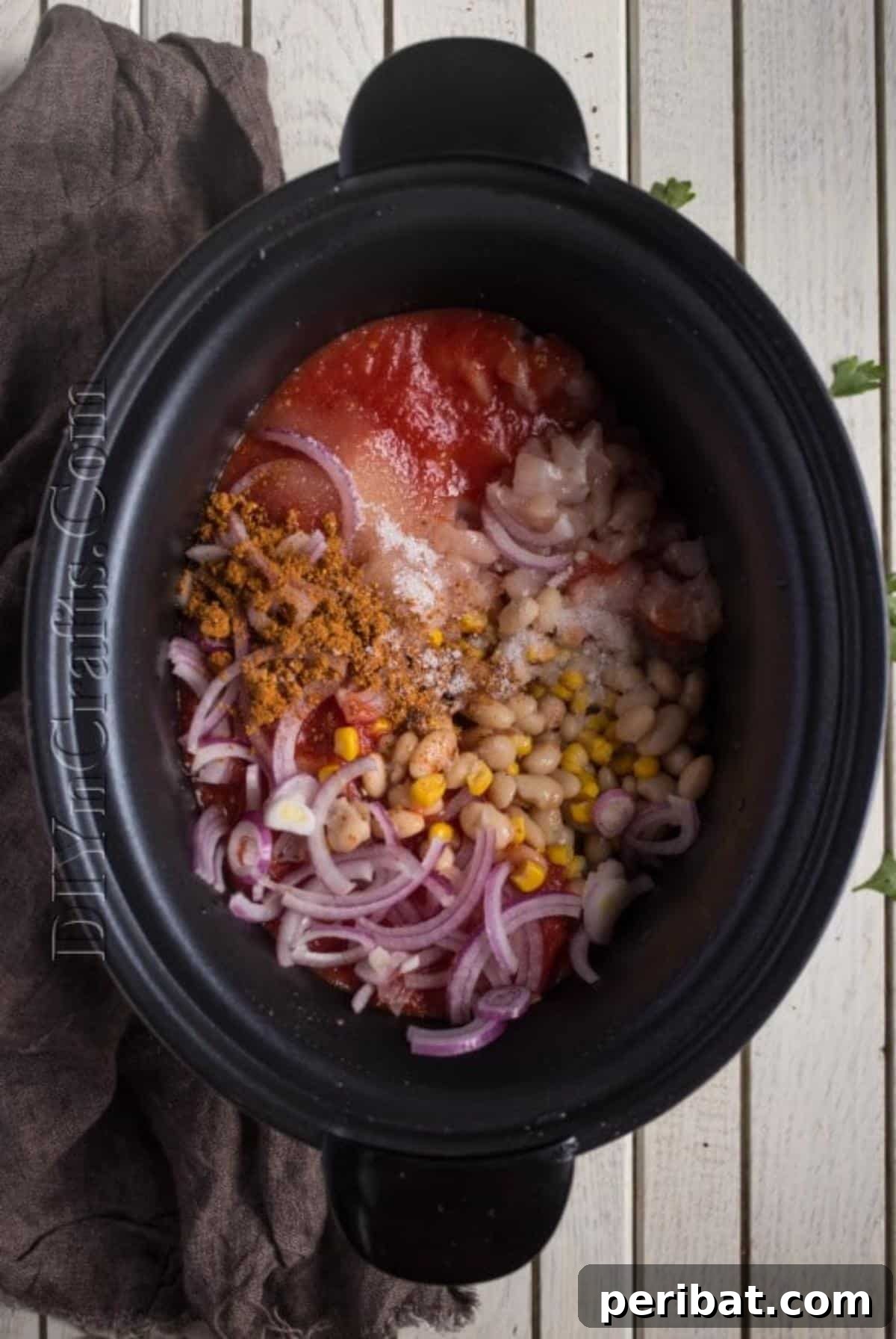 All ingredients mixed together in the slow cooker, ready to cook