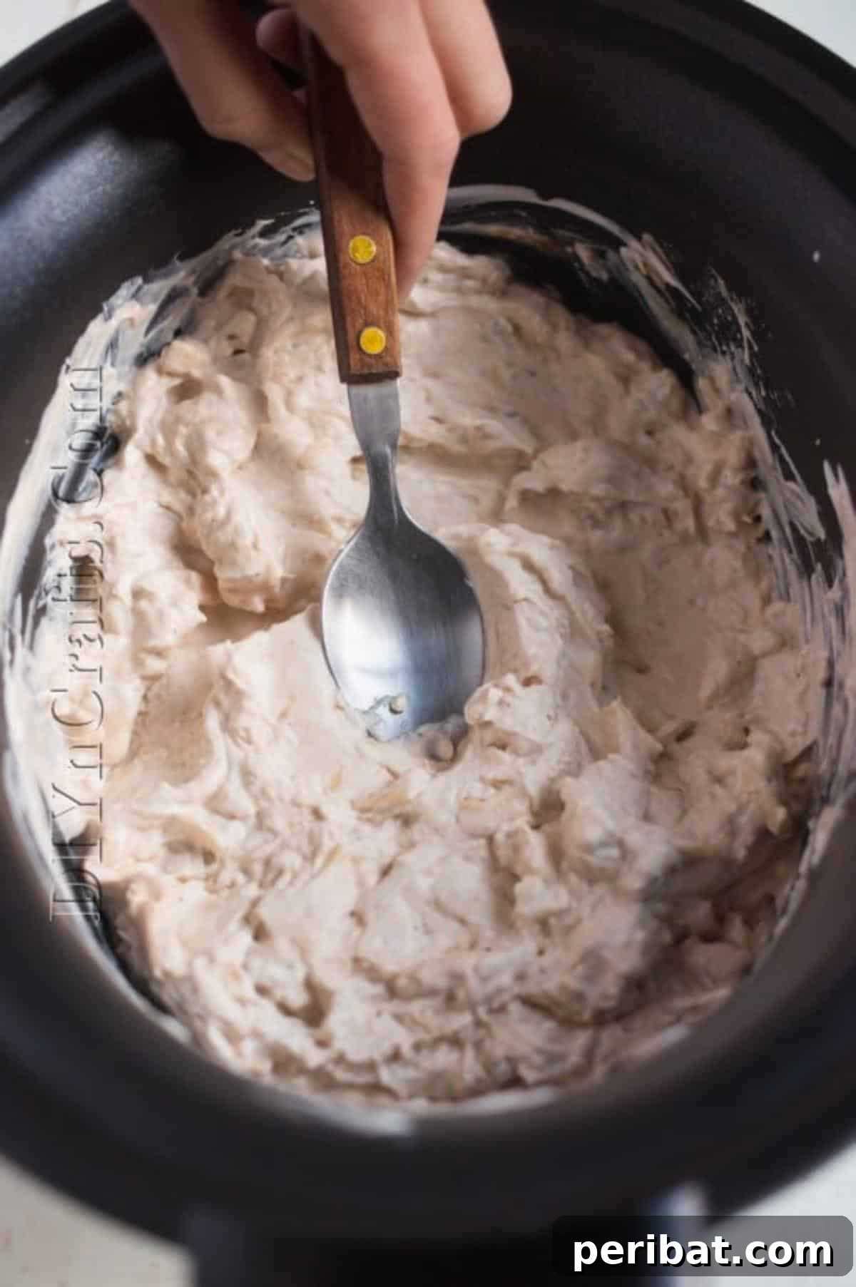 This Irresistible Cheese Dip Will Be The Star of Your Next Party 4 Mixing cream cheese.