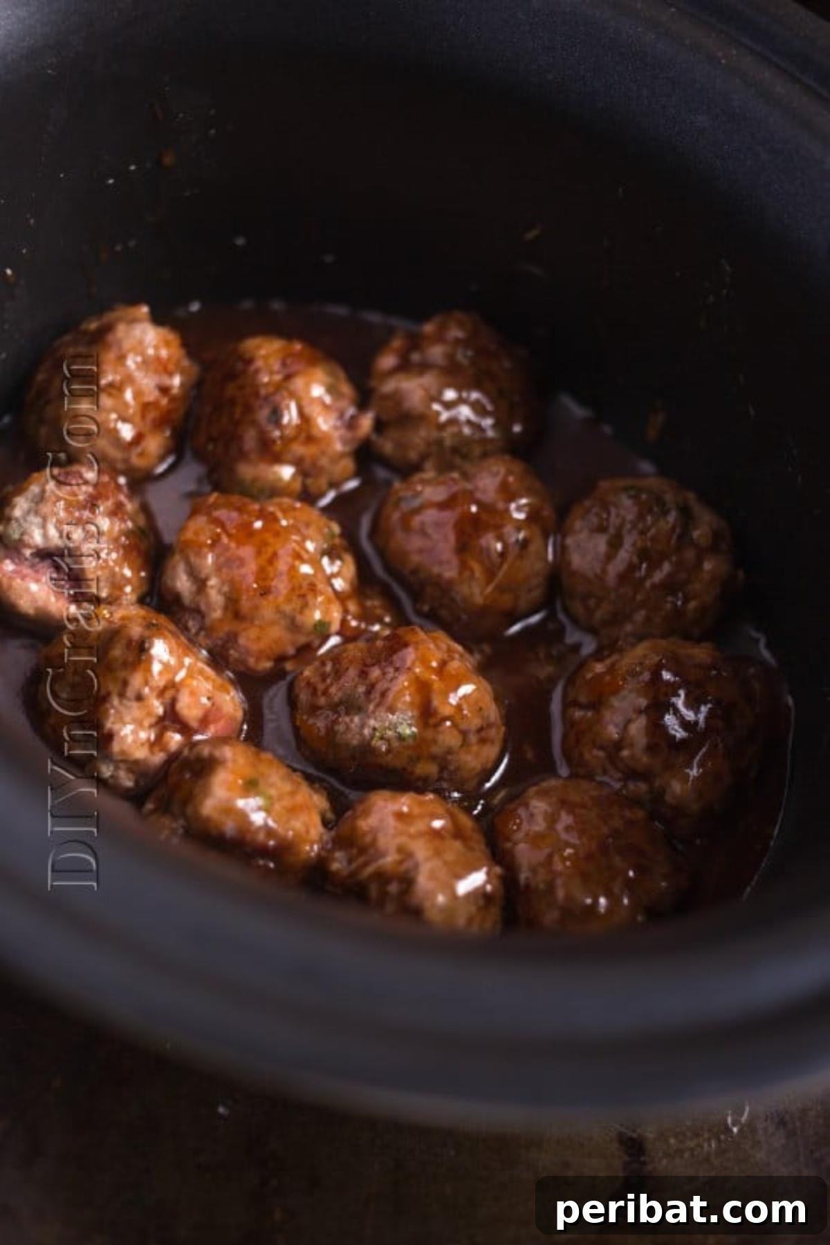 Your Go-To Meatballs: Fast, Flavorful, Flexible 7 Slow cooker with glazed meatballs ready for cooking.