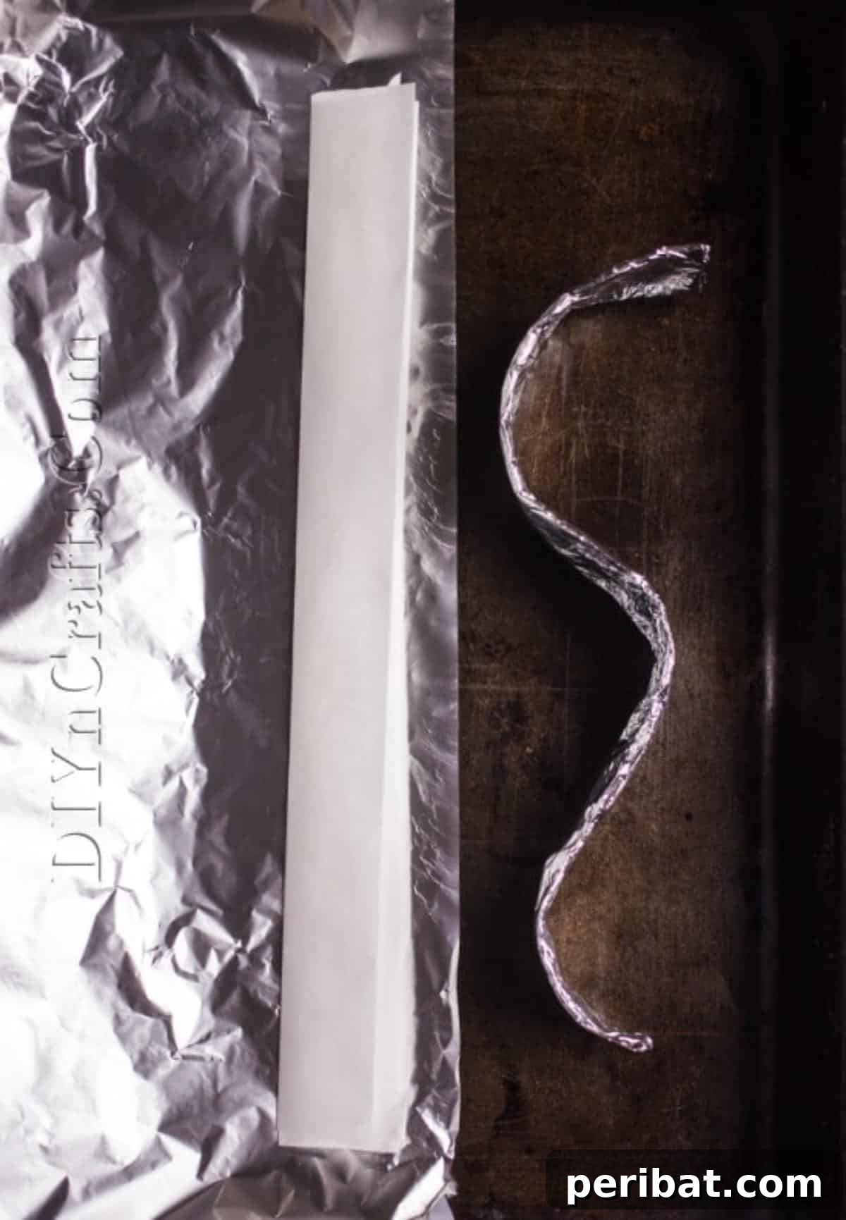 Creating a foil and parchment paper rack for the chicken