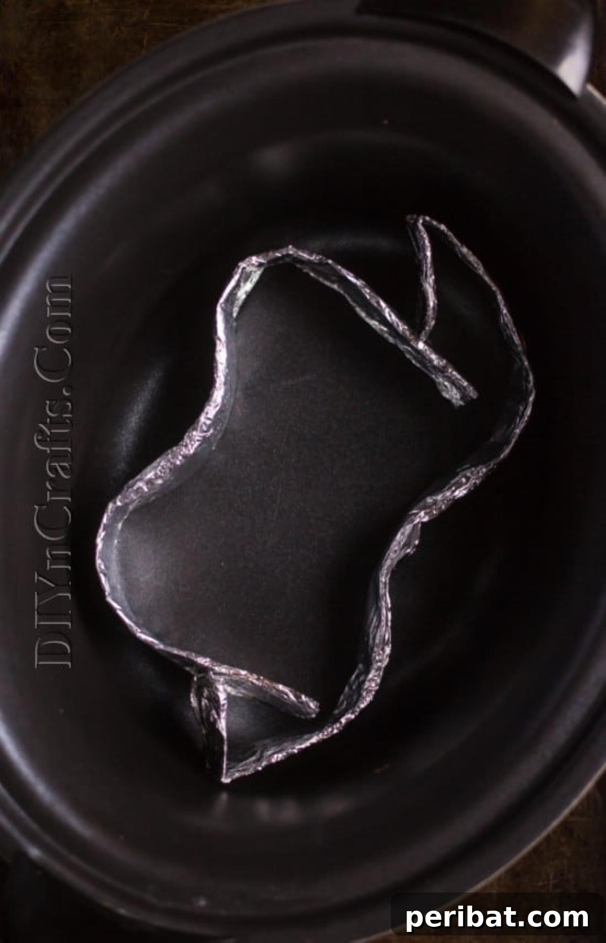 Positioning the homemade rack in the slow cooker