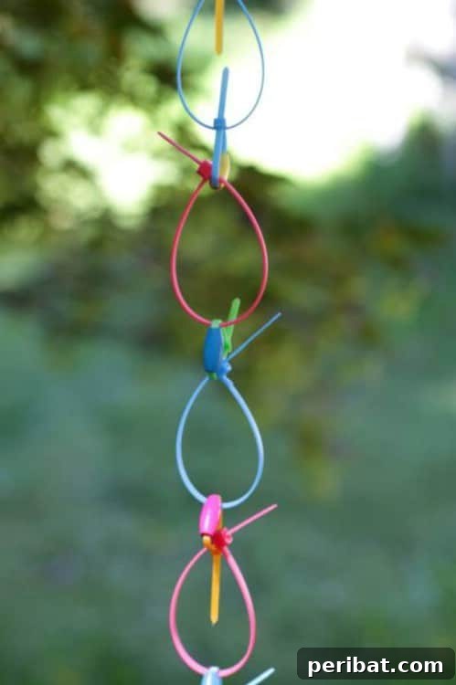 15 Brilliant DIY Rain Chains: Turn Downspouts into Delightful Water Features 11 Bright DIY Neon Zip Tie Rain Chain
